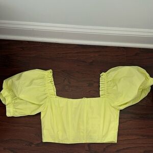 Pale yellow corset crop top.